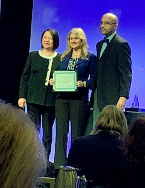 West Hills College Lemoore President (center) accepts Leader College of Distinction honor from Achieving the Dream, a reform movement geared toward student success.